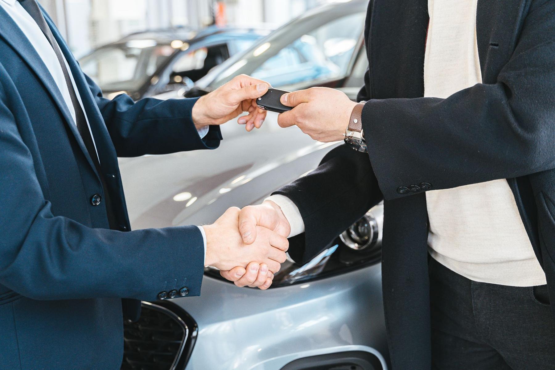 Car keys being handed over